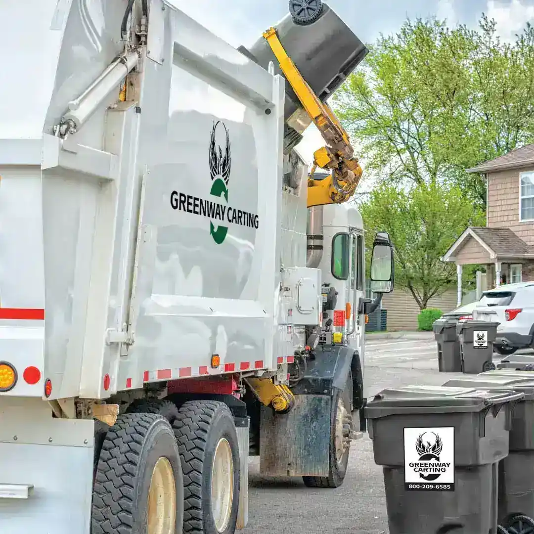 Greenway Carting trash collection truck with residential waste cart